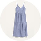 A tiered and textured long baby blue dress with thin straps.