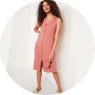 A model wearing pink sleeveless midi shift dress.