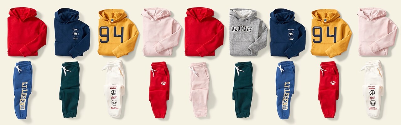 An array of colorful gender neutral sweatshirts & sweatpants.