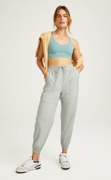 Female model wearing dynamic fleece jogger and tank top.