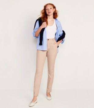 A female model wearing light colored Wow Skinny style pants