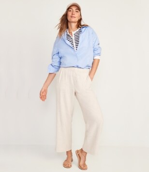 A model in a pair of light colored Linin-Blend Wide Leg pants.