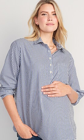 A female model wears a blue striped Maternity Boyfriend Popover Shirt