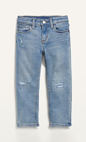 Image features distressed blue jeans.