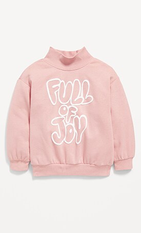 Image features long-sleeve pink mockneck graphic tee.