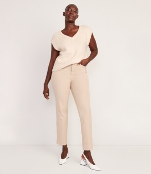 A female model wearing light coloured Pixie Straight style pants