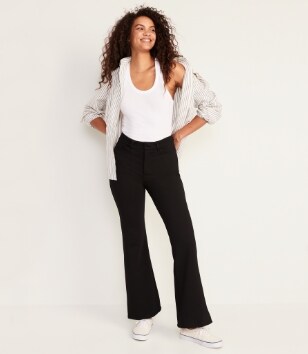 A model in a pair of black Stevie Trouser Flare pants.