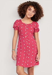 A young model wearing puff-sleeve button front fit and flare dress.