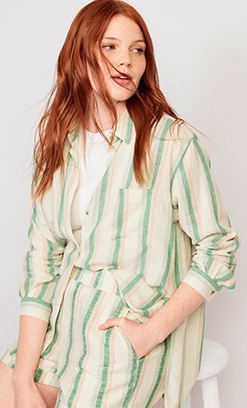 A female model wearing a light green Oversized Striped Linen-Blend Boyfriend Shirt & matching shorts