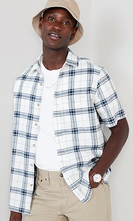 A male model wears a blue & white Regular-Fit Everyday Short-Sleeve Linen-Blend Shirt