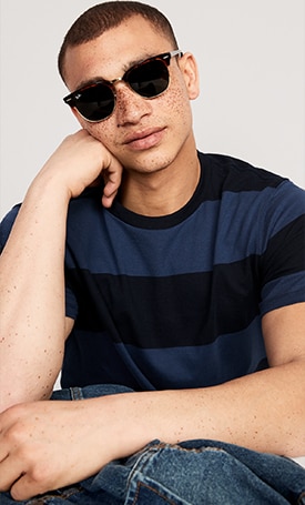 A male model wears a dark blue Striped Crew-Neck T-Shirt