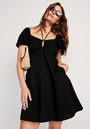 Female model wearing black flutter-sleeve linen-blend halter keyhole mini swing dress for women.