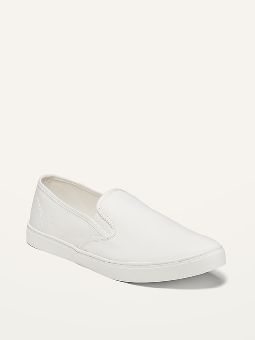 white canvas slip on sneakers