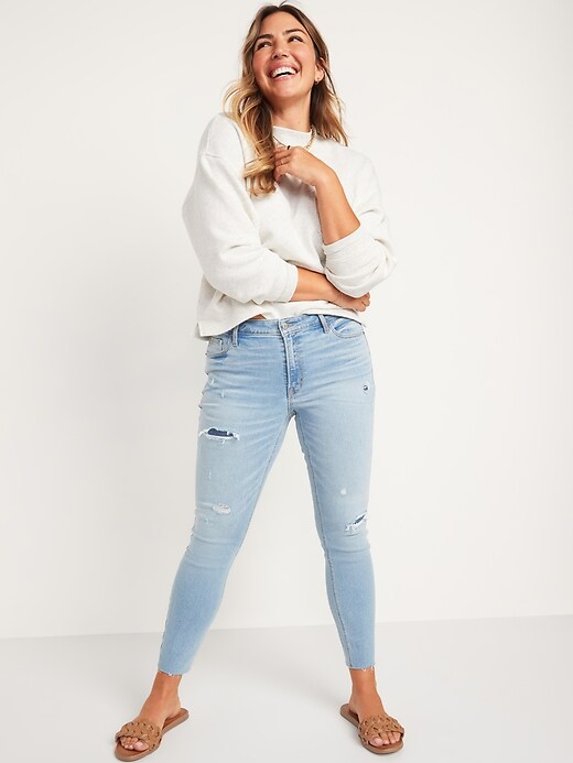 Image number 3 showing, Mid-Rise Rockstar Super-Skinny Ripped Ankle Jeans for Women