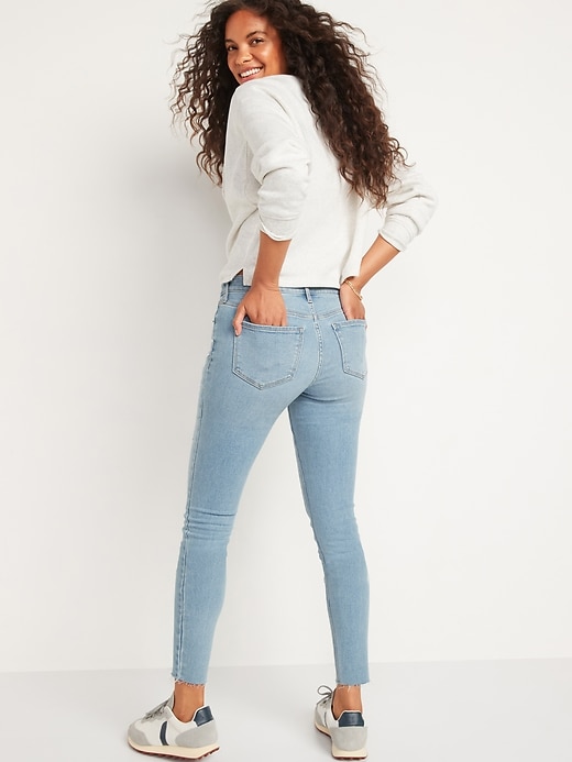 Image number 2 showing, Mid-Rise Rockstar Super-Skinny Ripped Ankle Jeans for Women
