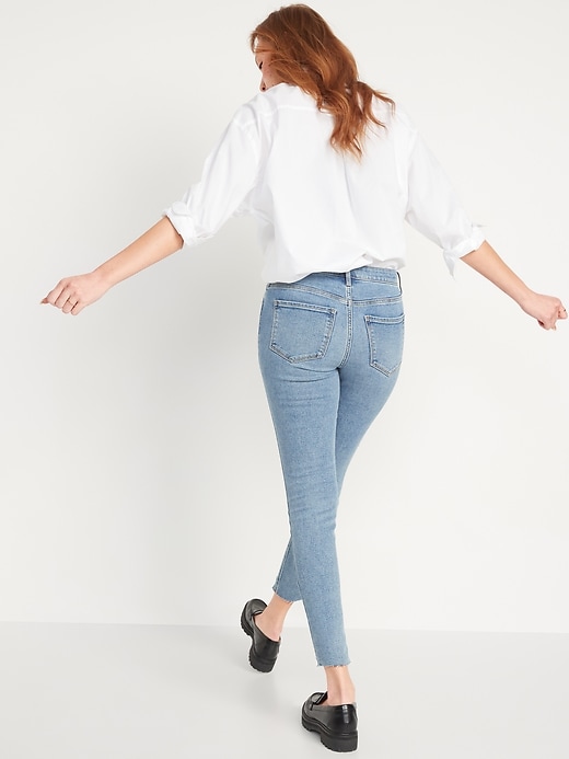 Image number 2 showing, Mid-Rise Rockstar Super-Skinny Ripped Cut-Off Ankle Jeans for Women