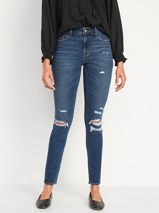 Image number 1 showing, Mid-Rise Rockstar Super-Skinny Ripped Jeans for Women