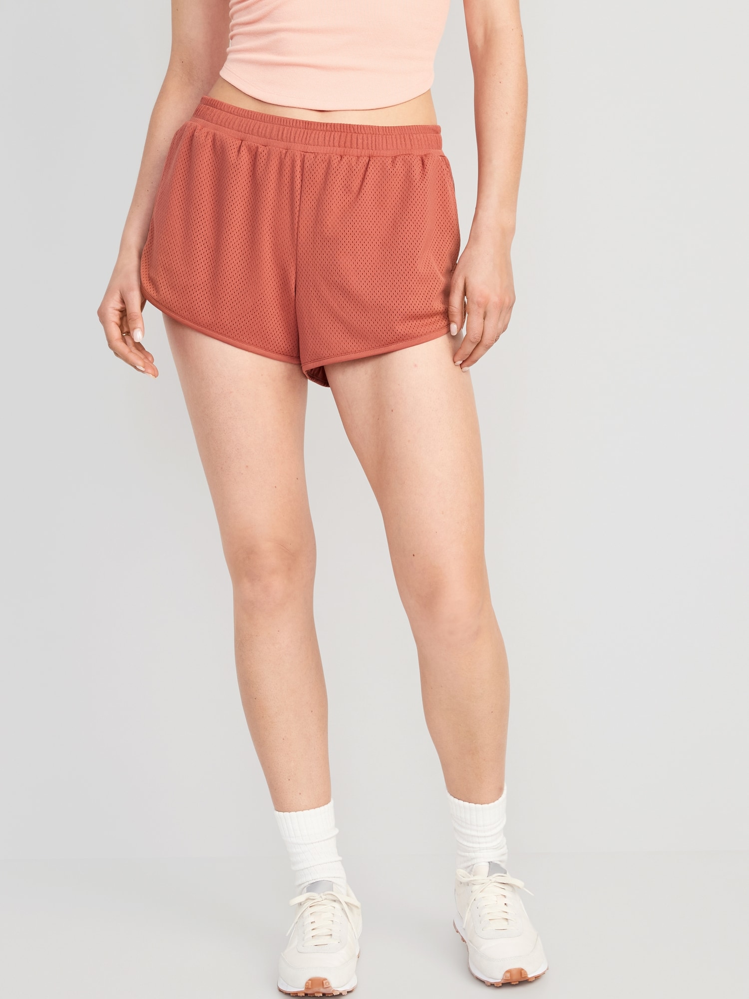 Old Navy Mid-Rise Dolphin-Hem Mesh Performance Shorts for Women -- 3-inch inseam orange. 1