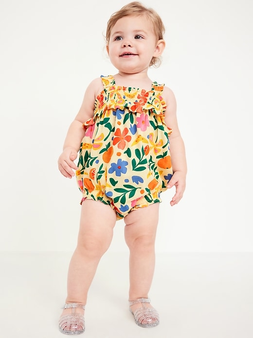 View large product image 1 of 1. Sleeveless Ruffle-Trim Smocked One-Piece Romper for Baby