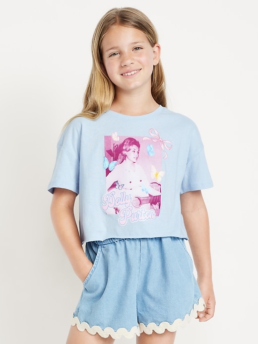 View large product image 1 of 3. Dolly Parton™ Oversized Cropped Graphic T-Shirt for Girls