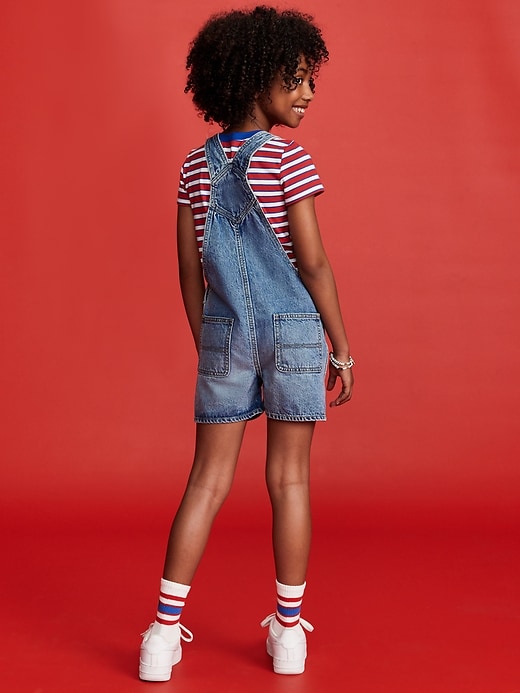 View large product image 2 of 5. Old Navy x Disney© Baggy Jean Shortalls for Girls