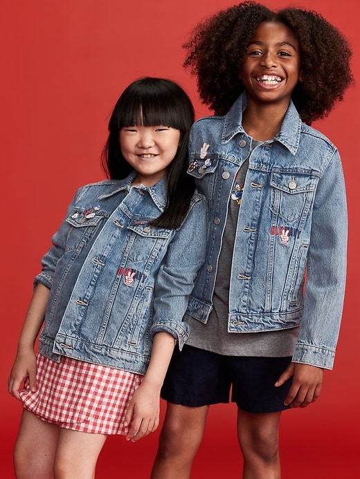 View large product image 1 of 5. Old Navy x Disney© Mickey Mouse Gender-Neutral Logo-Graphic Jean Trucker Jacket for Kids