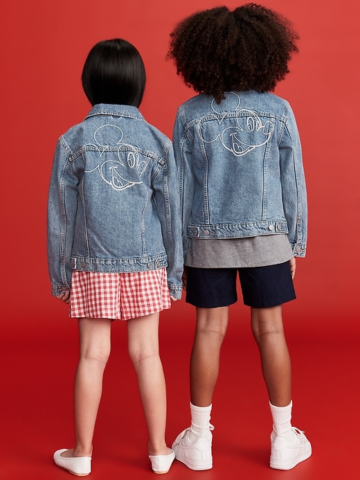 View large product image 2 of 5. Old Navy x Disney© Mickey Mouse Gender-Neutral Logo-Graphic Jean Trucker Jacket for Kids