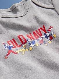 View large product image 3 of 5. Old Navy x Disney© Short-Sleeve Flag Logo-Graphic Bodysuit for Baby