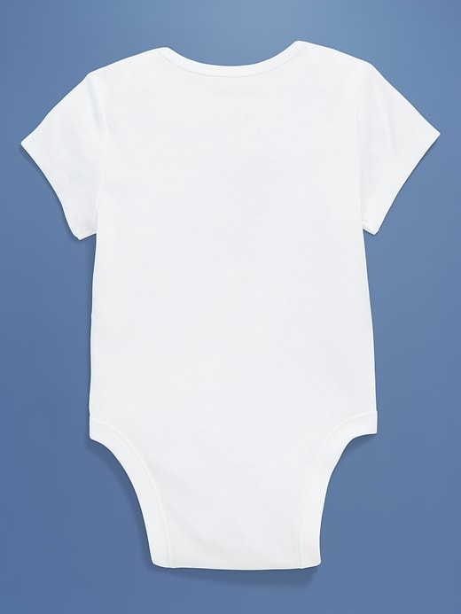 View large product image 2 of 5. Old Navy x Disney© Mickey Mouse Short-Sleeve Flag Logo-Graphic Bodysuit for Baby