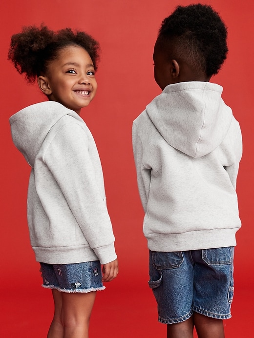 View large product image 2 of 4. Old Navy x Disney© Mickey Mouse Flag Unisex Graphic Pullover Hoodie for Toddler