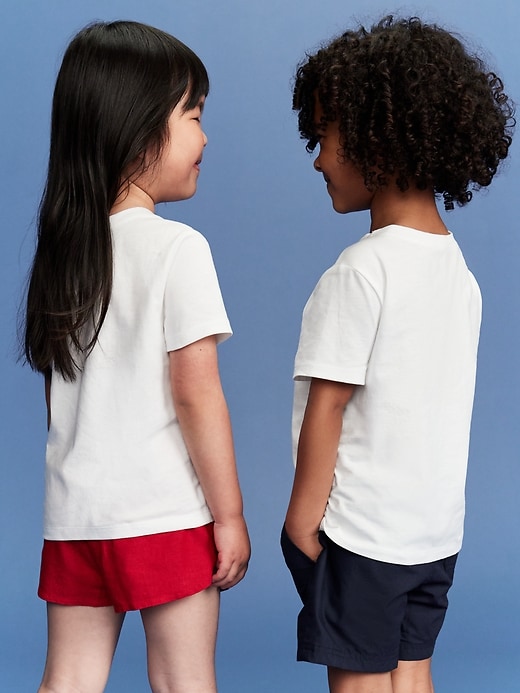 View large product image 2 of 3. Old Navy x Disney© Mickey Mouse Unisex Flag Logo-Graphic T-Shirt for Toddler