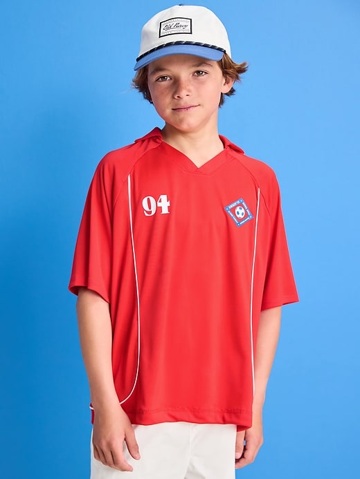 View large product image 1 of 3. Oversized Collared Graphic Performance Top for Boys