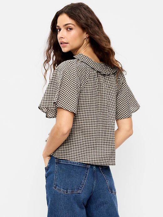 L'image numéro 2 présente Haut à volants noué à l’avant