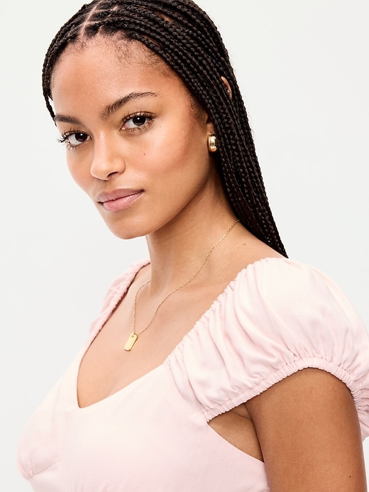 L'image numéro 4 présente Robe mi-longue ajustée et évasée à manches courtes