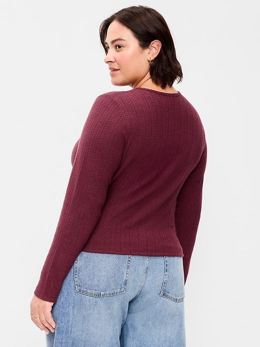 L'image numéro 6 présente Haut en tricot pointelle à manches longues boutonné sur le devant